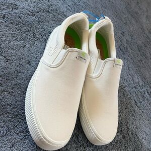 Cariuma White Canvas Slip-On Sneakers with Green Insoles